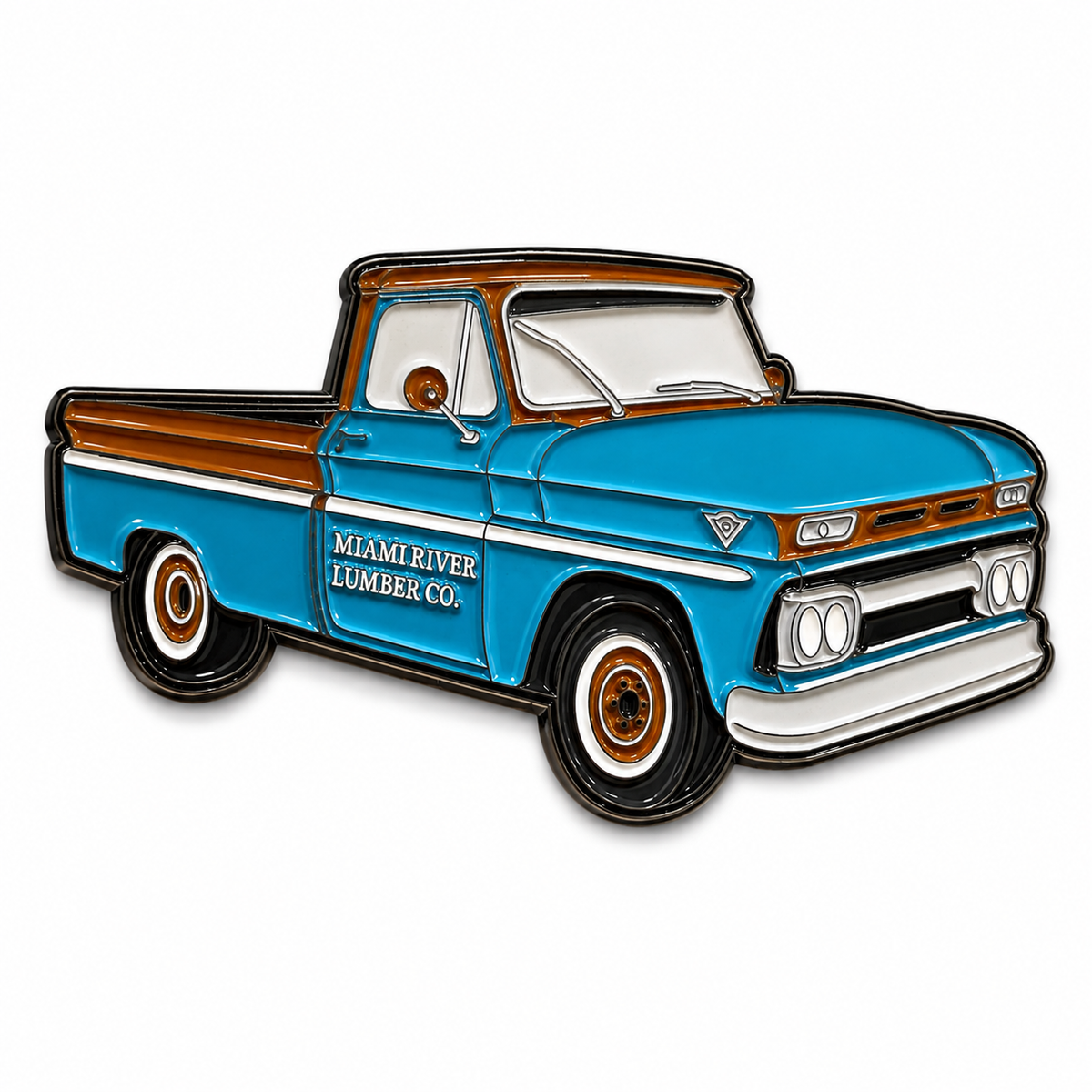 A vintage-style enamel magnet of a blue pickup truck with brown wood paneling, white trim, and the text 'MIAMI RIVER LUMBER CO.' on the side, shown on a plain white background.